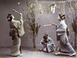 Young Geishas in Traditional Costume Playing 'Hanetuki'