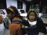 Buy Small Baby on the Back of Young Girl, Nepal at AllPosters.com