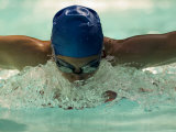 Young Woman Swimming the Butterfly Stroke in a Swimming Pool, Bainbridge Island, Washington, USA