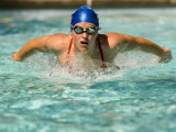 Young Woman Swimming the Butterfly Stroke in a Swimming Pool, Bainbridge Island, Washington, USA