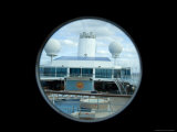 Looking Down on the Pool Deck of a Cruise Ship Through a Porthole