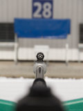 A Rifle Points at a Target on a Range at a Biathalete Center