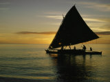 Buy Silhouetted Outrigger Canoe on the Koro Sea at AllPosters.com