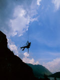 Buy A Rock Climber Dangles on His Rope in Preparation for His Next Move in Chachapoyas, Peru at AllPosters.com