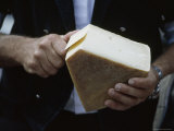Dairy Farmer Samples Cheese at an Annual Cheese Dividing Ritual, Bernese Alps, Switzerland