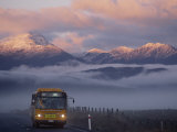 Buy Bus at Sunrise with the Mountains Covered in a Blanket of Fog at AllPosters.com