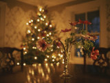 Buy Floral Centerpiece with a Lit Christmas Tree in a Dining Room at AllPosters.com