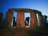 Buy A View of Stonehenge Silhouetted by Lights at Twilight at AllPosters.com