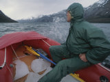 Rafting Across Fjord of the Mountains in an Inflatable Boat