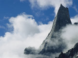 The Karakoram Ranges Fathi Tower Rises Through the Clouds
