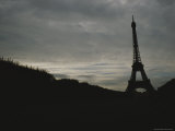The Eiffel Tower Silhouetted against a Gray, Cloud-Filled Sky