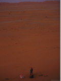 Two Men Meet in the Sand Dunes of the Arabian Desert