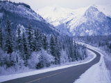 Buy Winter View of the Highway Surrounded by Snow-Covered Mountains at AllPosters.com