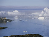 Buy Icebergs from the Ilulissat Glacier Float by a Fishing Village at AllPosters.com