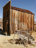 A Wooden Cart Decays in Front of an Abandoned Building