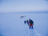 Scientists Studying the Volcano Trudge Through the Snow Toward a Waiting Helicopter
