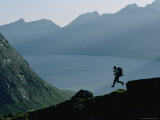 A Man Runs Down a Hill Toward Base Camp Near Tasermiut Fjord