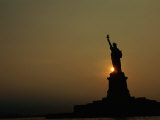 The Statue of Liberty Silhouetted in the Setting Sun