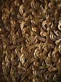 Ornate Flame-Like Carving Surrounds Buddha on a Relief Sculpture