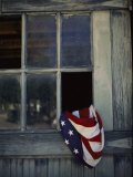 Buy An American Flag Lies Loosely Bunched in an Open Window at AllPosters.com