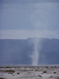 The Vertical Cloud of a Dust Devil Rises from the Desert