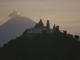 Buy Popocatepetl Volcano Rises Behind a Hilltop Church in Cholula at AllPosters.com