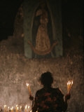 A Mexican Woman Prays to the Virgin Mary During a Religious Ceremony