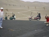 Die-Hard Golfers Putt on Grassless Greens That are Slathered in Oil Photographic Print