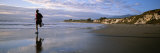 Buy A Man Jogs Along Sands Beach Below Ellwood Bluffs, at Sunset at AllPosters.com