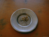 Buy A Ceramic Plate with Nuggets Sitting on a Wooden Table at AllPosters.com