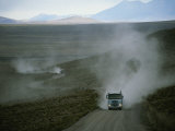 Buy Trucks Traveling Through the Atacama Desert Stir up Clouds of Dust at AllPosters.com