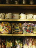 Toiletry Bags and Food Enamel Bowls Lined up near a Washroom