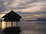 Tahitian Over-Water Bungalow at Sunset with Moorea Island in Distance