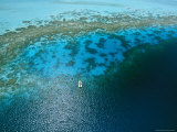Buy Lone Boat Floats over a Coral Reef as Seen from Helicopter in Bora Bora at AllPosters.com