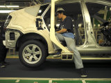 An Auto Worker Assembling a Hybrid Car at Plant in Japan