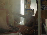 Buy A Man Makes an Offering at a Hindu Temple in Singapore at AllPosters.com