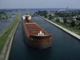 Buy Ore Freighter Ship Exits the Soo Locks on the St. Mary's River, Michigan at AllPosters.com