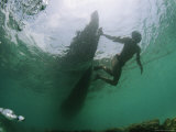 Buy Underwater View of Moken Tribesmen Swimming as He Holds onto a Boat at AllPosters.com