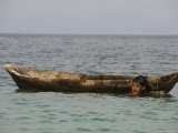 Buy Moken Tribesman in Goggles Alongside His Dugout Canoe at AllPosters.com
