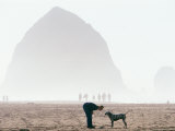 Playing Frisbee on Misty Morning, Cannon Beach, Oregon, USA