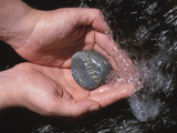 Buy Person Holding Rock with the Word Friend in Rushing Water at AllPosters.com