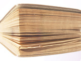 Close-up of Worn Hardcover Book with Yellowed Pages
