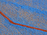 Close-up of Rough Blue and Gray Fabric with a Brown Stripe