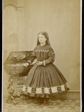 Girl Wears a Dress with Loose Pleated Bodice a Crinoline Supported Short Skirt