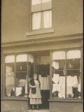 Woman Standing in the Doorway of a Modest Clothing Shop