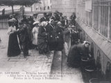 Pilgrims Drink the Water from the Miraculous Healing Spring