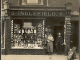 The Proprietors Stand Outside Their Newsagent's Shop