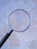 Magnifying Glass and Blue Background