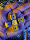 Hand Holds Buttons Pointing Different Directions