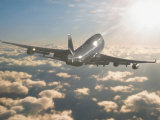 Buy Jumbo Jet Above Clouds Into Sunlight at AllPosters.com